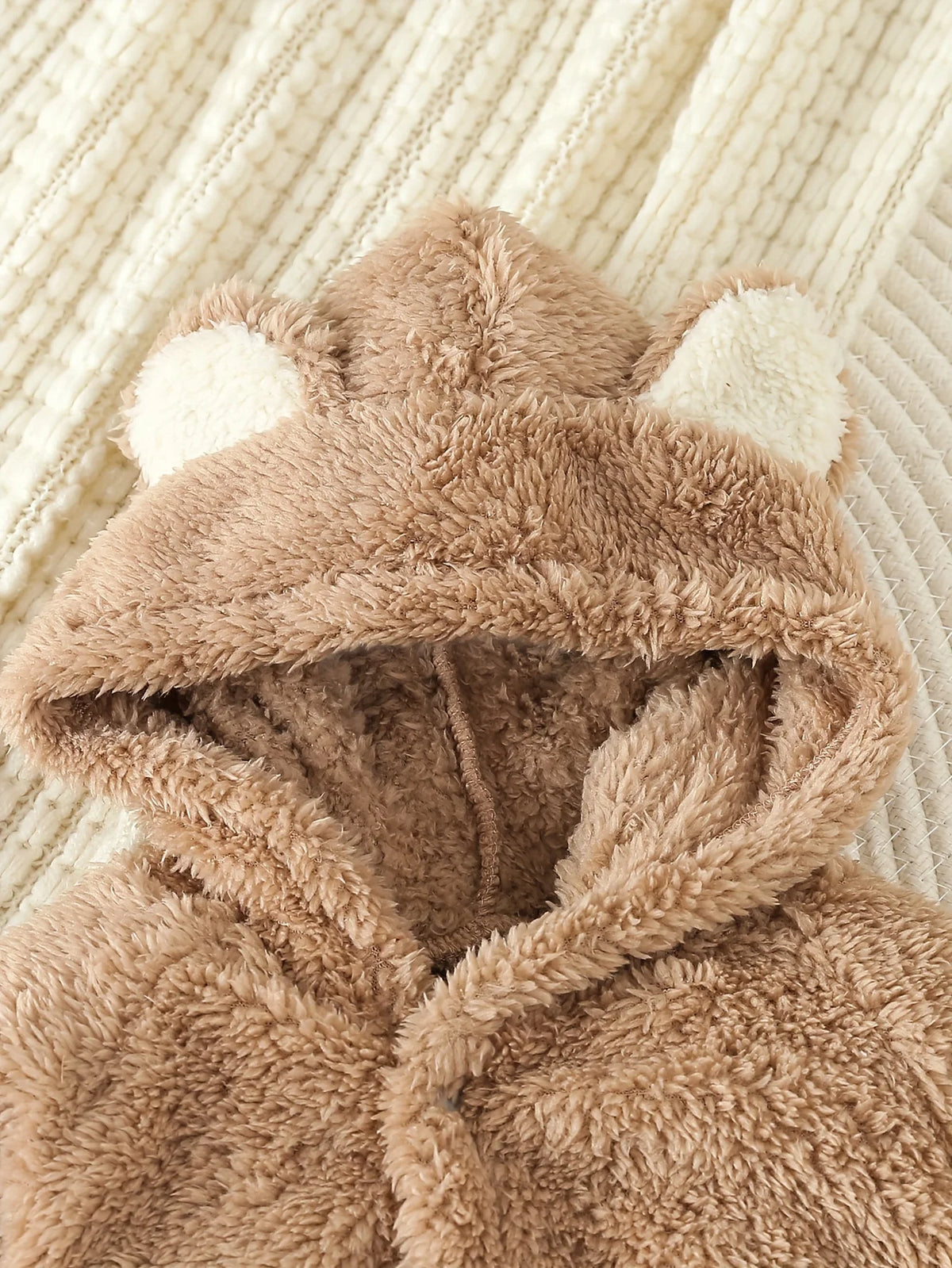 Close-up of the bear hood with round ears
