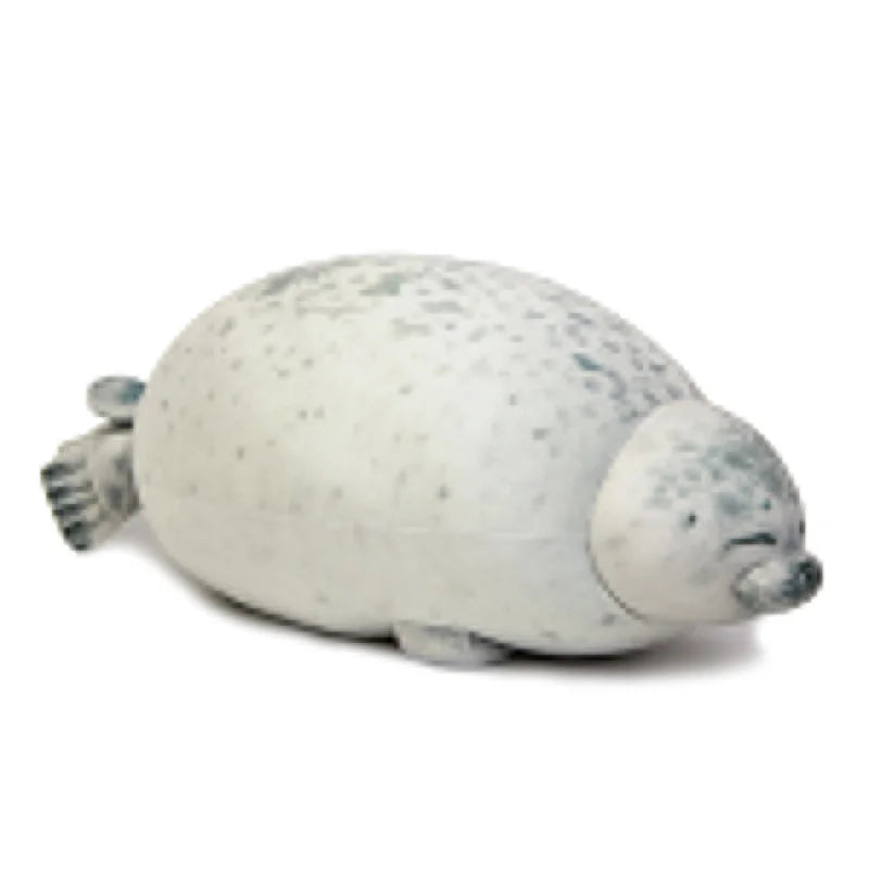 Close-up of the seal plush's face and fluffy fur