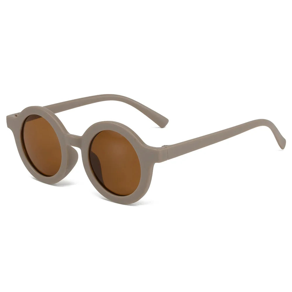 Side view of round children's sunglasses showing the flexible arms