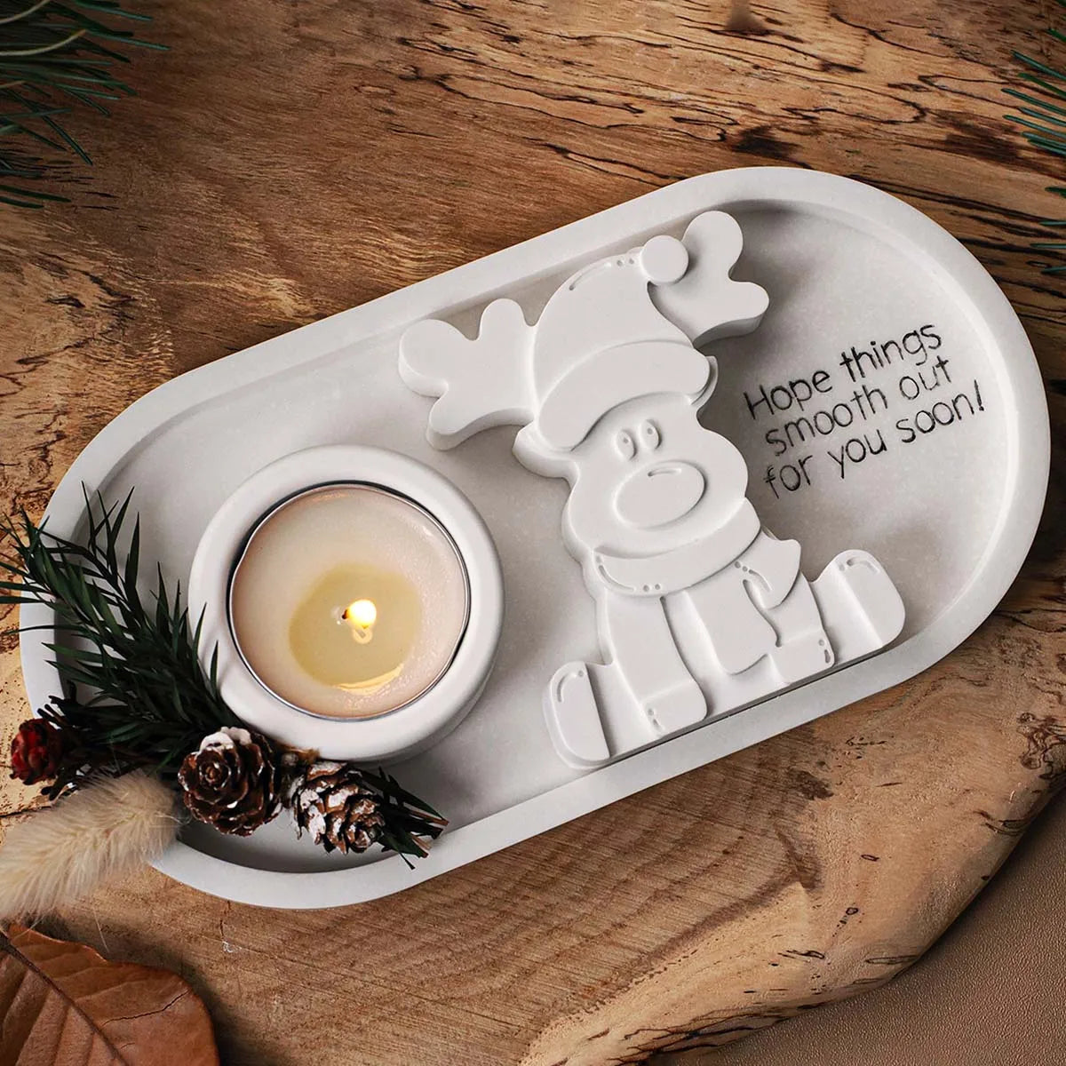 Finished plaster reindeer couple displayed as Christmas decoration