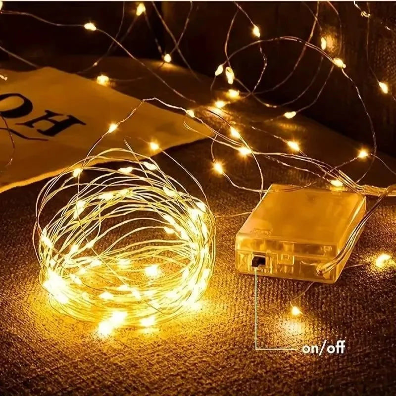 Copper wire fairy lights battery powered, glowing warm white