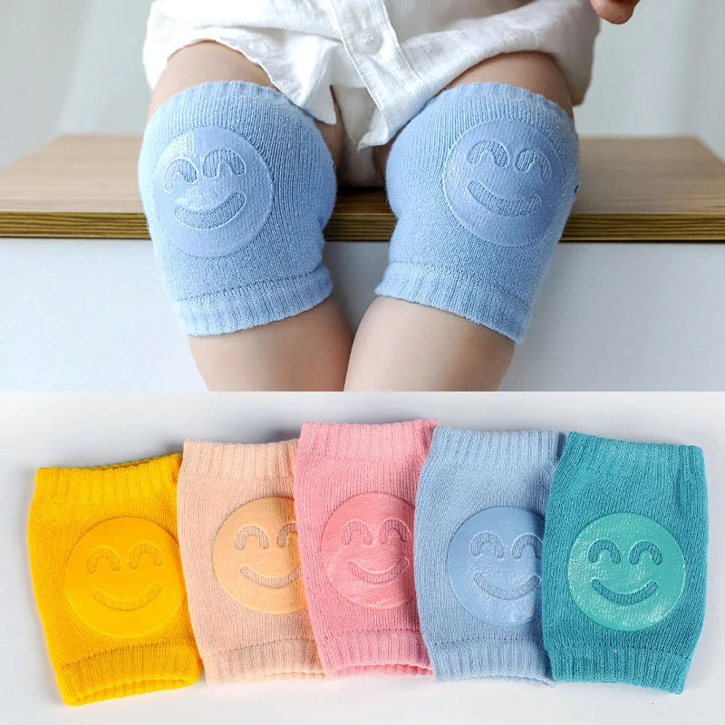 Baby crawling knee pads in soft fabric on a baby's legs