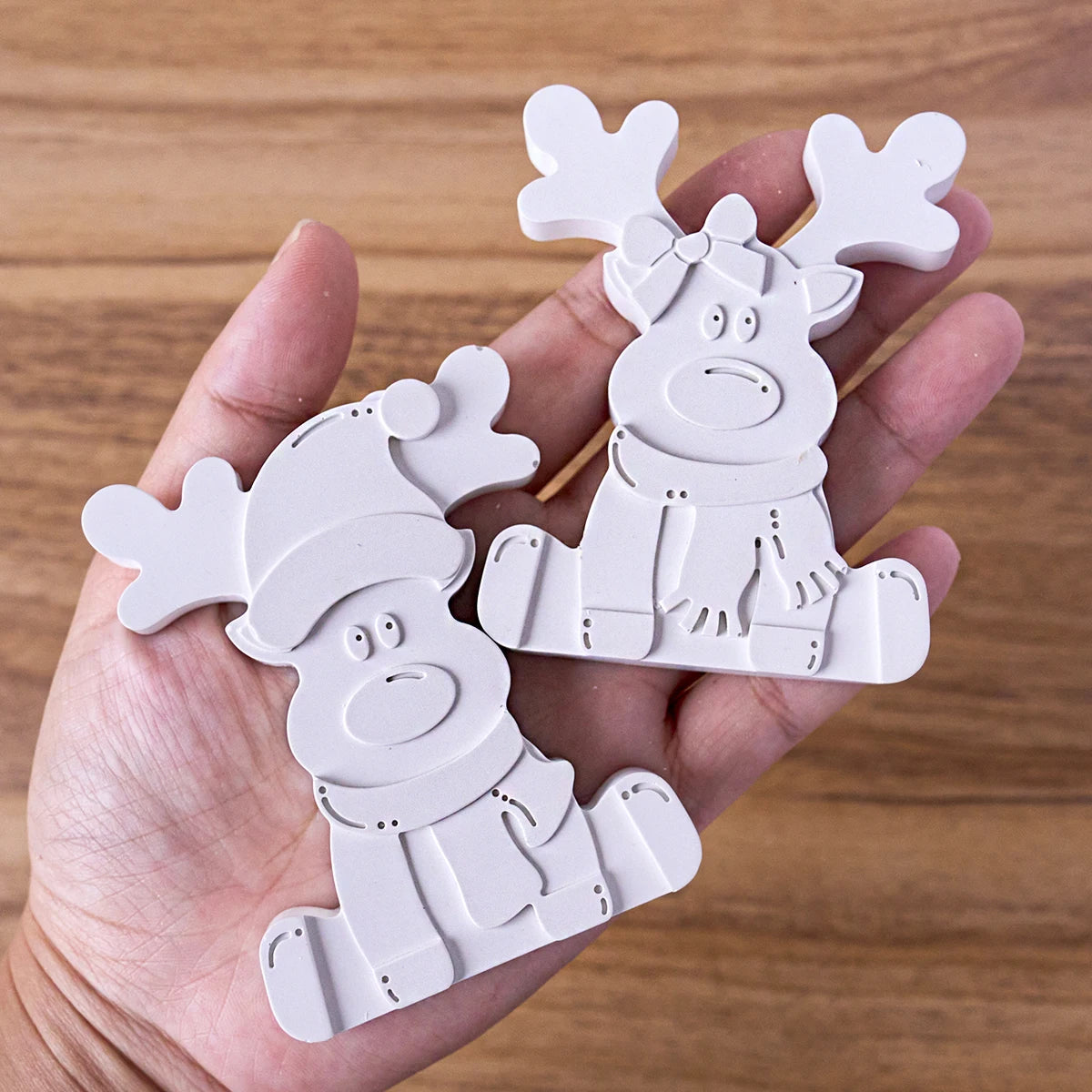 Flexible silicone mold held to show the reindeer shape