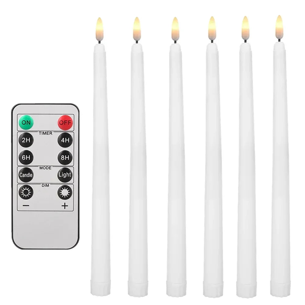 LED taper candles lit in the evening beside a window