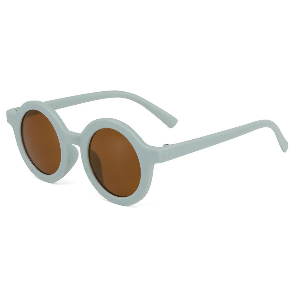 Several pairs of round kids sunglasses in different colors